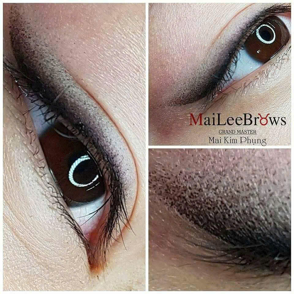 Defines eyes with lash line tattoo.